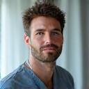 Portrait of Dr. Ben Carter, a sleep researcher, depicted in a calm, thoughtful pose against a soft, subtle background, indicating his focus on sleep science.